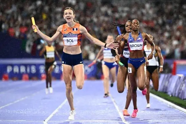 A group of women running on the track.