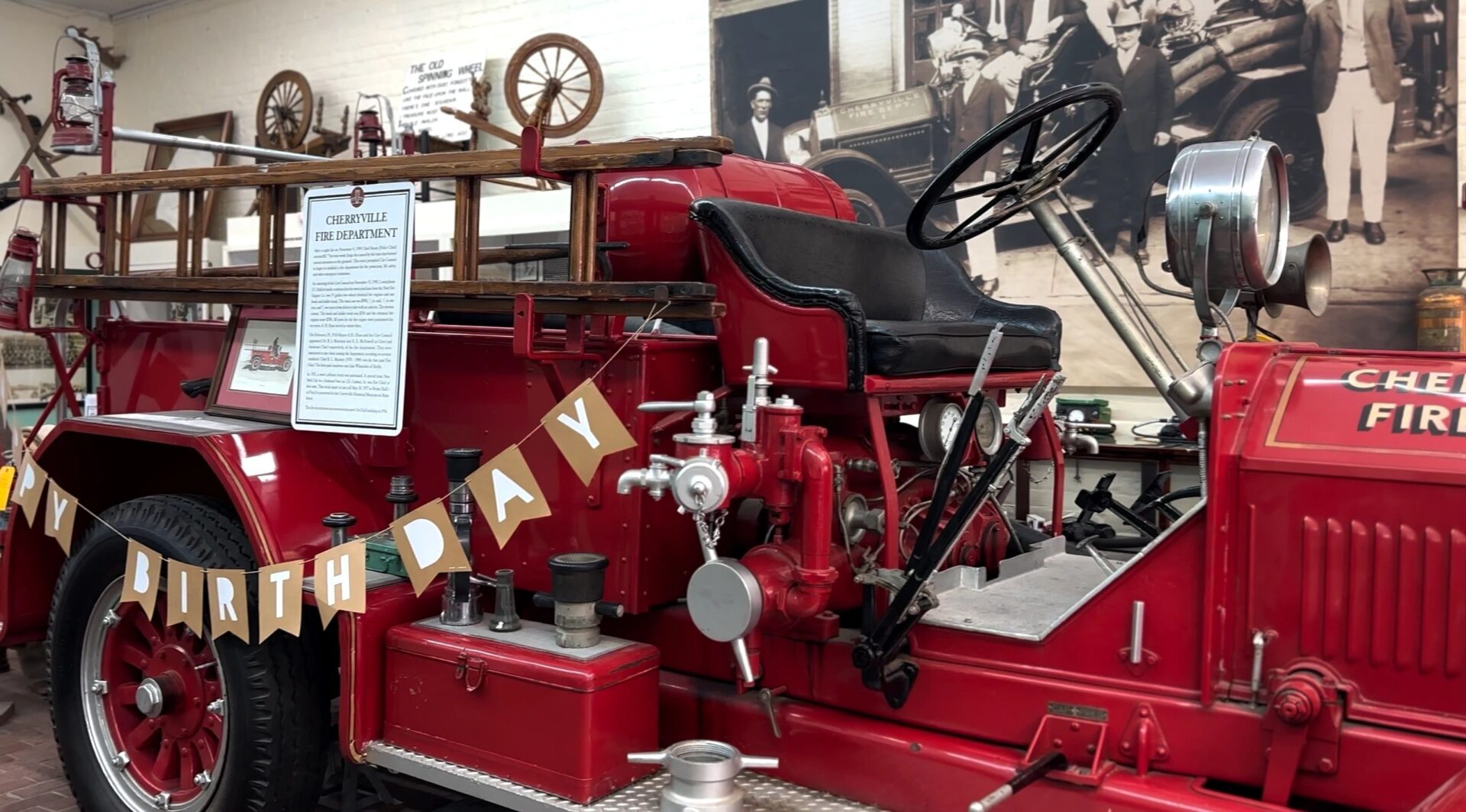 A red fire truck with a steering wheel on it.